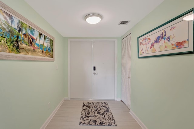 3209 S Lakeview Cir Unit 8-101, Hutchinson Island, FL 34949 - doorway to outside featuring light wood-style floors