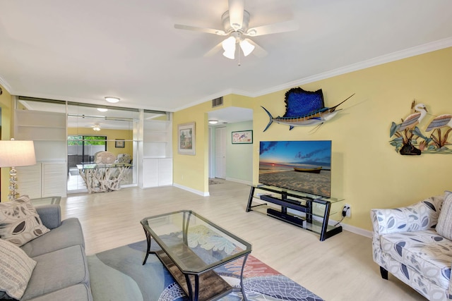 3209 S Lakeview Cir Unit 8-101, Hutchinson Island, FL 34949 - living room featuring wood finished floors, ceiling fan, and ornamental molding