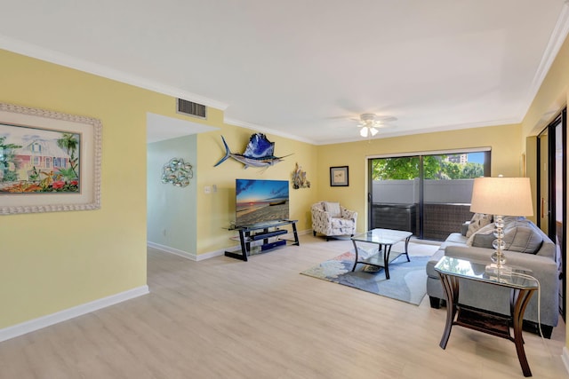 3209 S Lakeview Cir Unit 8-101, Hutchinson Island, FL 34949 - living area with wood finished floors, ornamental molding, and a ceiling fan