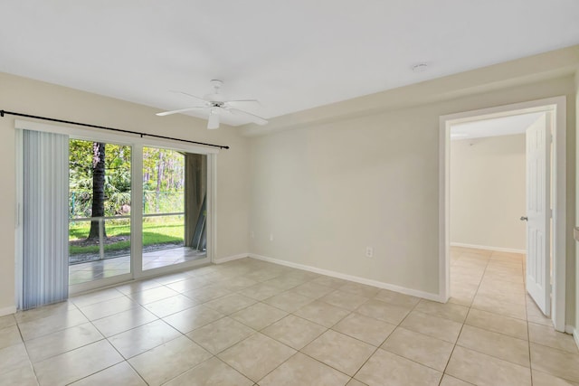 3693 NW Adriatic Ln, Jensen Beach, FL 34957 - unfurnished room featuring light tile patterned flooring, a ceiling fan, baseboards, and a smoke detector