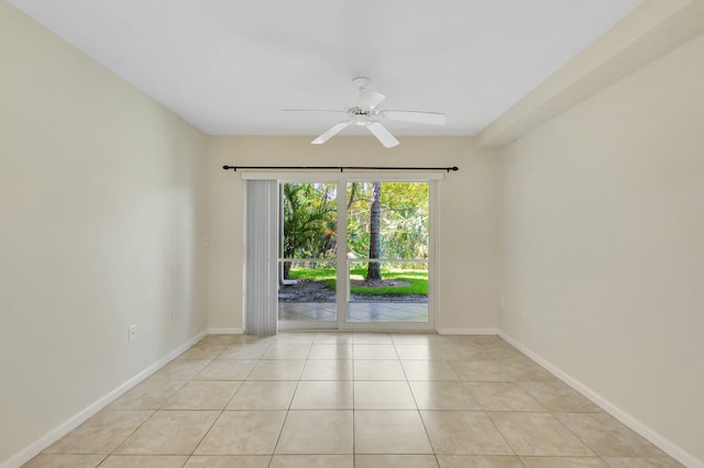 3693 NW Adriatic Ln, Jensen Beach, FL 34957 - unfurnished room with a ceiling fan, light tile patterned floors, and baseboards