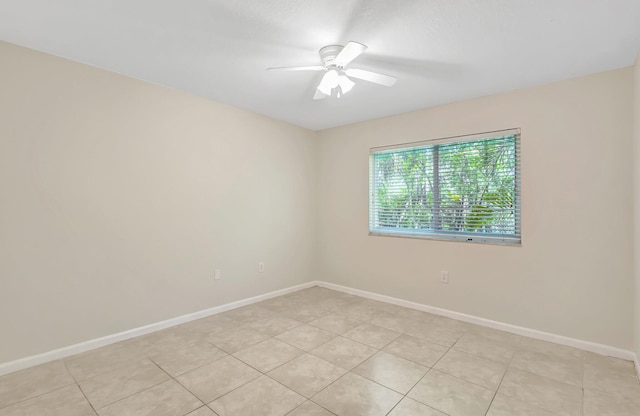 3693 NW Adriatic Ln, Jensen Beach, FL 34957 - empty room featuring a ceiling fan, baseboards, and light tile patterned floors