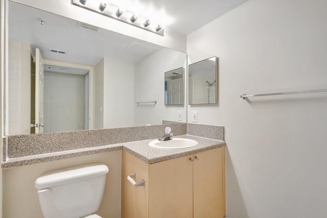 3693 NW Adriatic Ln, Jensen Beach, FL 34957 - bathroom featuring toilet and vanity