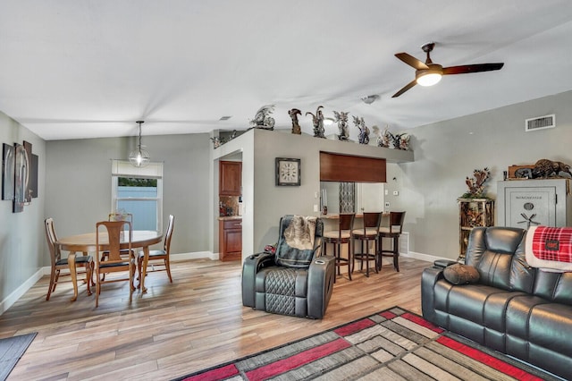 4641 Wadita Ka Way, West Palm Beach, FL 33417 - living room with ceiling fan, light wood-style flooring, baseboards, and vaulted ceiling