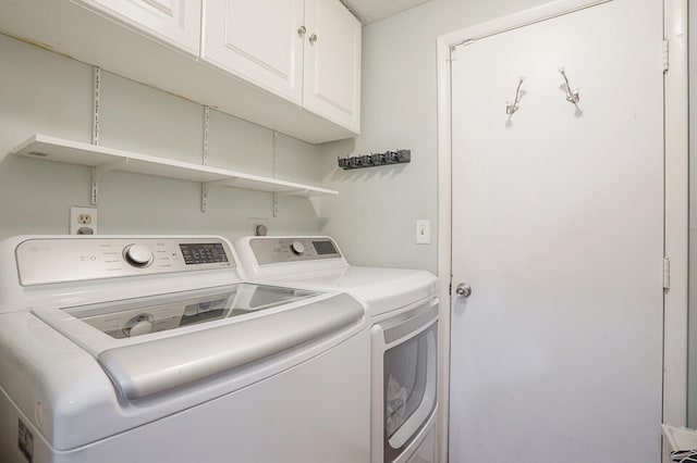 4641 Wadita Ka Way, West Palm Beach, FL 33417 - laundry room featuring washer and dryer and cabinet space