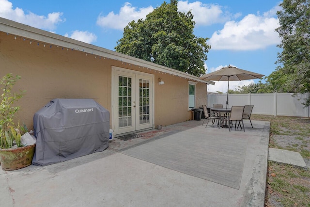 4641 Wadita Ka Way, West Palm Beach, FL 33417 - view of patio / terrace with french doors, outdoor dining area, and grilling area