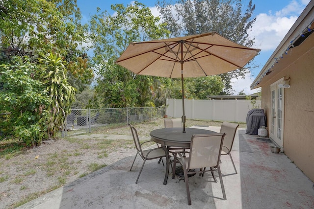 4641 Wadita Ka Way, West Palm Beach, FL 33417 - fenced backyard featuring outdoor dining area and a patio