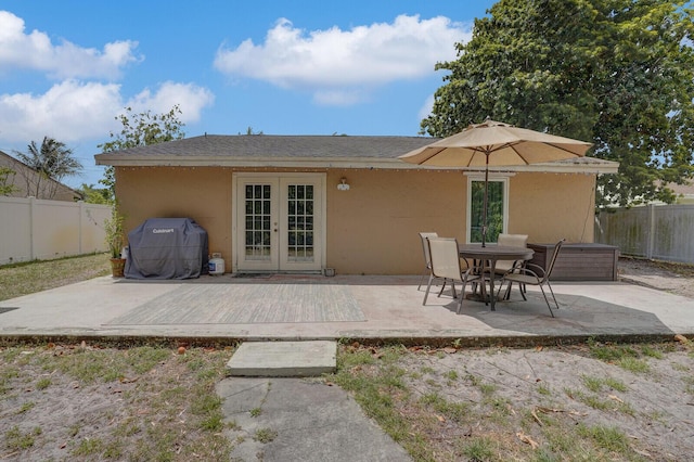4641 Wadita Ka Way, West Palm Beach, FL 33417 - back of property with french doors, a fenced backyard, a patio area, stucco siding, and a wooden deck
