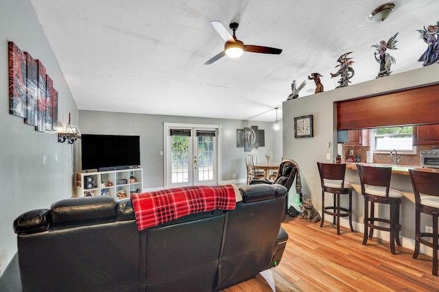 4641 Wadita Ka Way, West Palm Beach, FL 33417 - living room with french doors, light wood-type flooring, and a ceiling fan