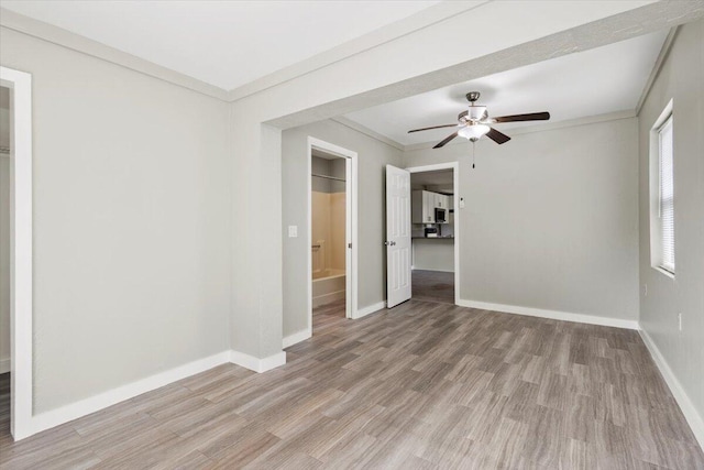 208 Olson Ave, Fort Pierce, FL 34946 - unfurnished room with baseboards, a ceiling fan, light wood-style floors, and crown molding