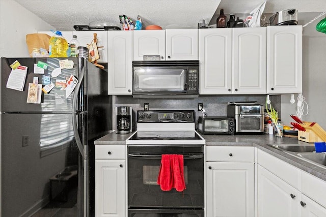 208 Olson Ave, Fort Pierce, FL 34946 - kitchen featuring black appliances, white cabinetry, a textured ceiling, and a sink