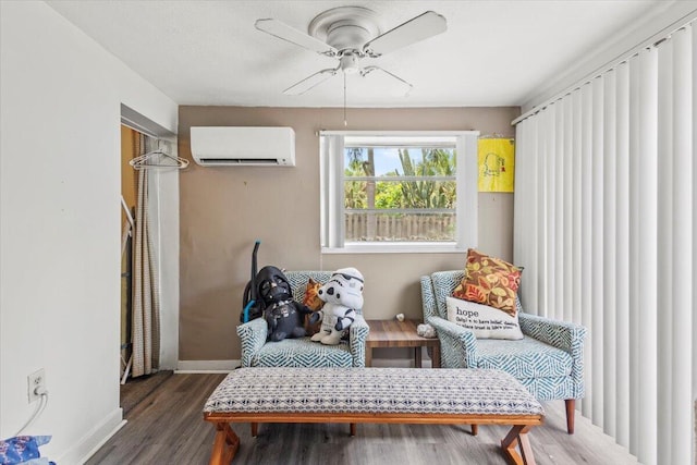 208 Olson Ave, Fort Pierce, FL 34946 - living area featuring a wall unit AC, a ceiling fan, baseboards, and wood finished floors