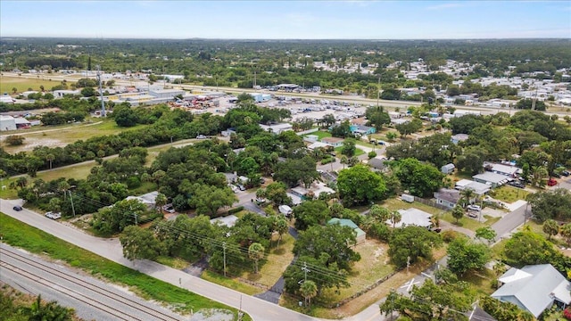 208 Olson Ave, Fort Pierce, FL 34946 - aerial perspective of suburban area featuring a tree filled landscape