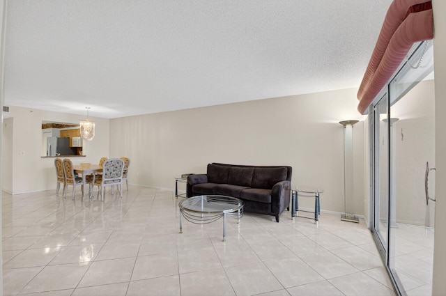 6112 Huntwick Ter Unit 106, Delray Beach, FL 33484 - living area with light tile patterned floors and a textured ceiling