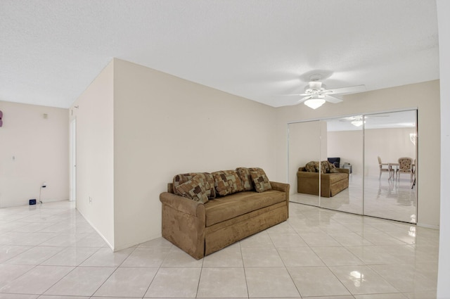 6112 Huntwick Ter Unit 106, Delray Beach, FL 33484 - sitting room featuring light tile patterned flooring and a ceiling fan