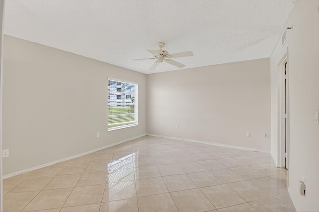 6112 Huntwick Ter Unit 106, Delray Beach, FL 33484 - unfurnished room featuring light tile patterned floors, a ceiling fan, and a textured ceiling
