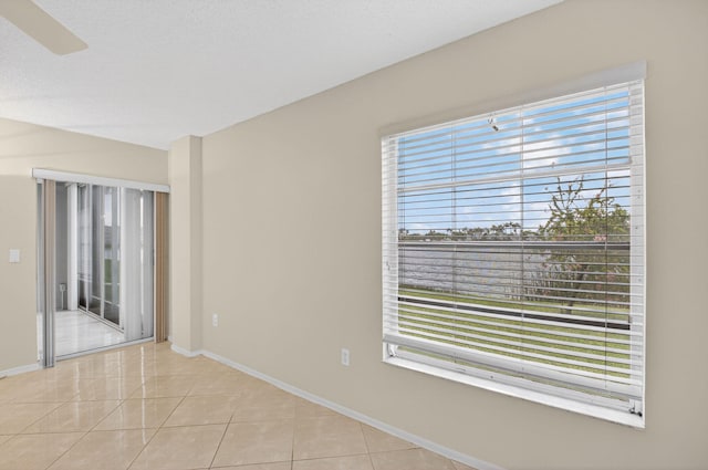6112 Huntwick Ter Unit 106, Delray Beach, FL 33484 - tiled empty room featuring baseboards