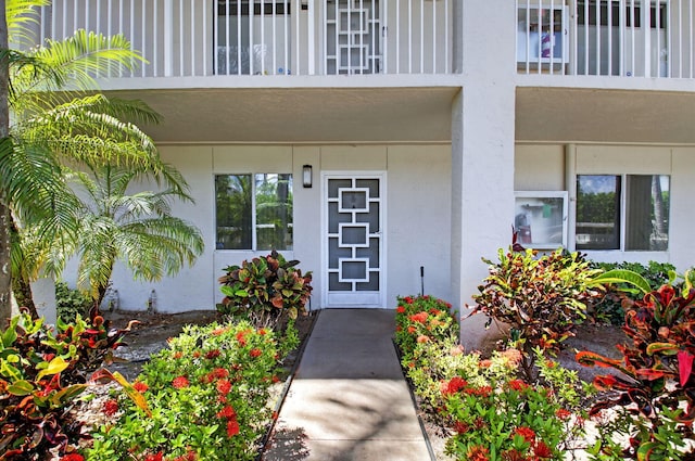 6112 Huntwick Ter Unit 106, Delray Beach, FL 33484 - doorway to property featuring stucco siding