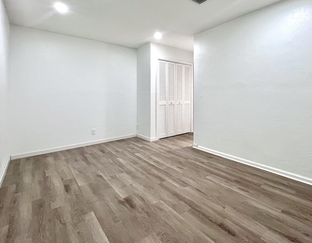 1430 SW 25th Way Unit B, Boynton Beach, FL 33426 - spare room featuring wood finished floors and recessed lighting
