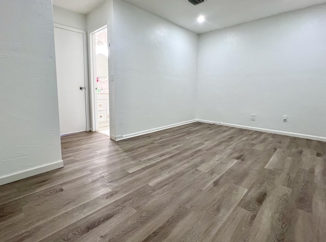 1430 SW 25th Way Unit B, Boynton Beach, FL 33426 - unfurnished room with wood finished floors and recessed lighting