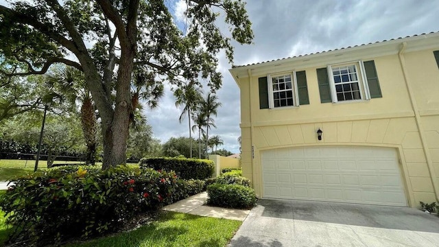 2039 Tarpon Lake Way, West Palm Beach, FL 33411 - garage featuring concrete driveway
