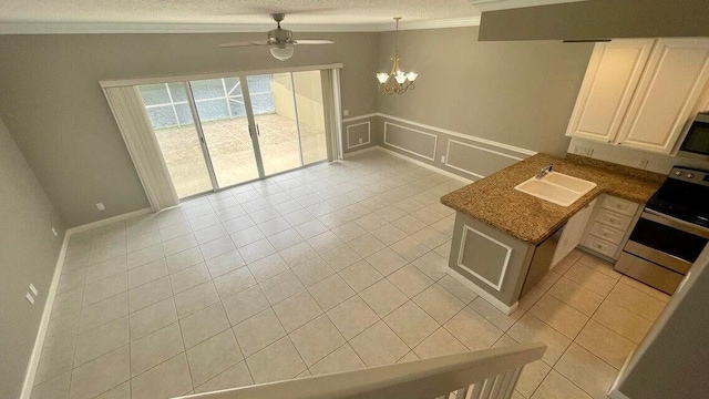 2039 Tarpon Lake Way, West Palm Beach, FL 33411 - kitchen featuring stainless steel electric stove, a sink, ornamental molding, a ceiling fan, and a chandelier