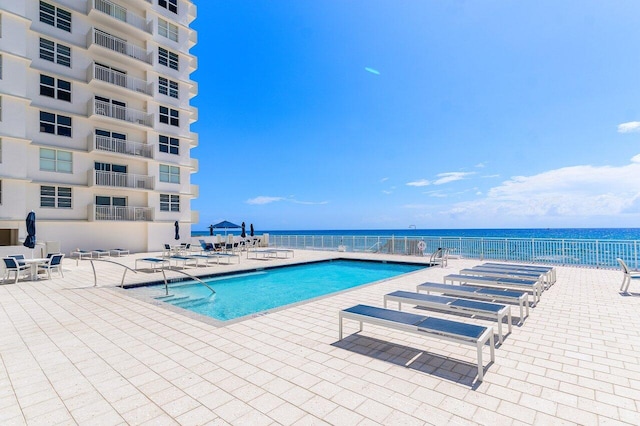 4505 S Ocean Blvd Unit 907, Highland Beach, FL 33487 - community pool with a patio area and a water view