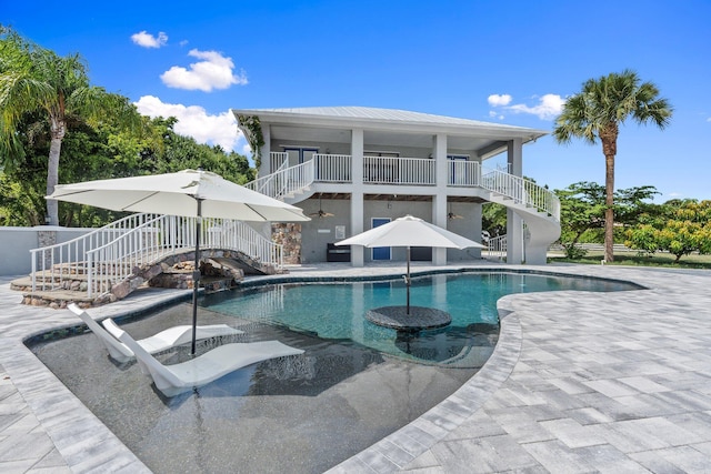 2130 W Boothe Dr, Fort Pierce, FL 34982 - outdoor pool featuring stairway, a patio, and ceiling fan