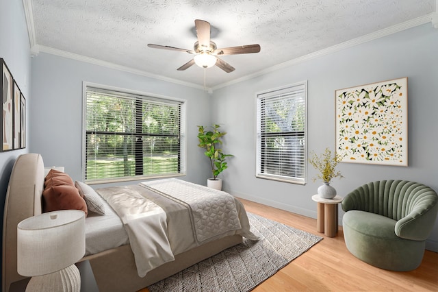 2130 W Boothe Dr, Fort Pierce, FL 34982 - bedroom with multiple windows, wood finished floors, ornamental molding, a ceiling fan, and baseboards