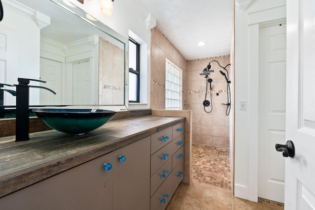 2130 W Boothe Dr, Fort Pierce, FL 34982 - bathroom featuring walk in shower, vanity, ornamental molding, and tile patterned floors