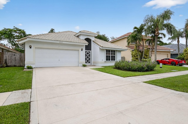 23440 Serene Meadow Dr S, Boca Raton, FL 33428 - mediterranean / spanish-style home featuring a tile roof, a garage, driveway, and stucco siding