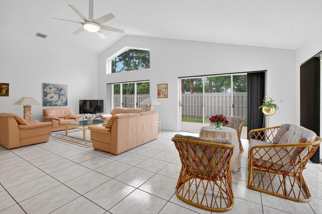 23440 Serene Meadow Dr S, Boca Raton, FL 33428 - living area with high vaulted ceiling, healthy amount of natural light, light tile patterned floors, and ceiling fan