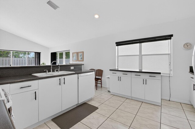 23440 Serene Meadow Dr S, Boca Raton, FL 33428 - kitchen featuring white dishwasher, a sink, vaulted ceiling, dark countertops, and white cabinets