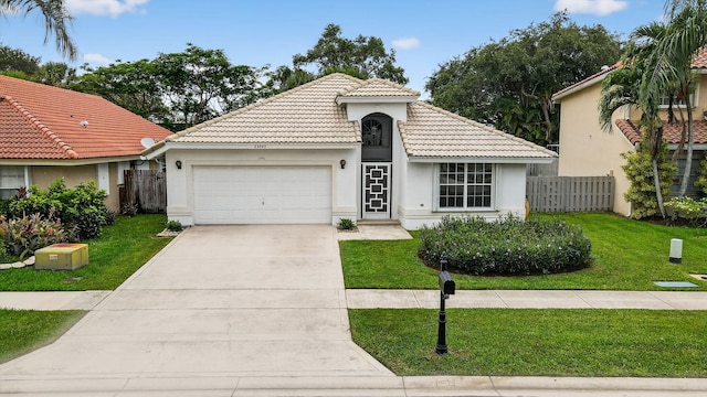 23440 Serene Meadow Dr S, Boca Raton, FL 33428 - mediterranean / spanish-style house featuring an attached garage, a tile roof, stucco siding, and driveway