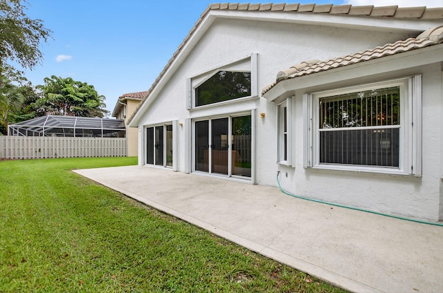 23440 Serene Meadow Dr S, Boca Raton, FL 33428 - rear view of property featuring stucco siding, a tile roof, and a patio area