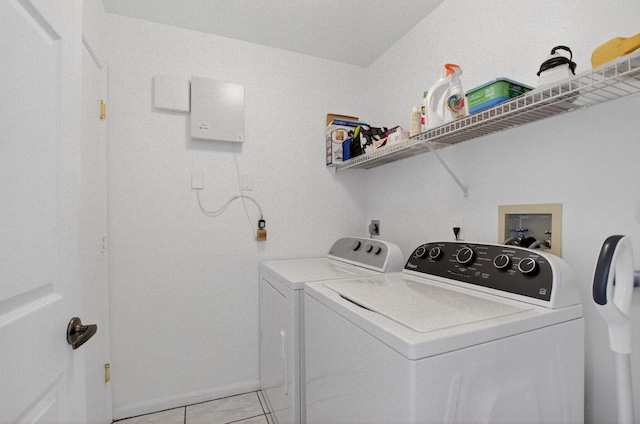 23440 Serene Meadow Dr S, Boca Raton, FL 33428 - laundry room with washer and clothes dryer and light tile patterned floors