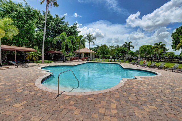 23440 Serene Meadow Dr S, Boca Raton, FL 33428 - community pool featuring a patio area