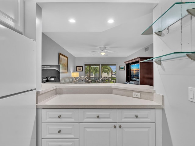 9855 Sandalfoot Blvd Unit 320, Boca Raton, FL 33428 - kitchen with freestanding refrigerator, ceiling fan, white cabinets, light countertops, and recessed lighting