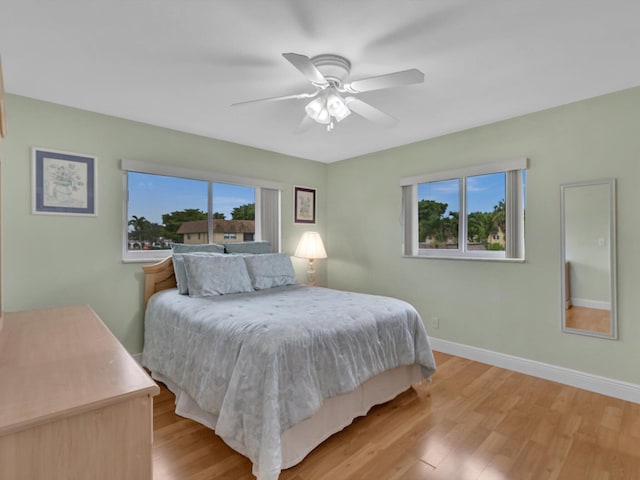 9855 Sandalfoot Blvd Unit 320, Boca Raton, FL 33428 - bedroom with light wood-style floors and ceiling fan