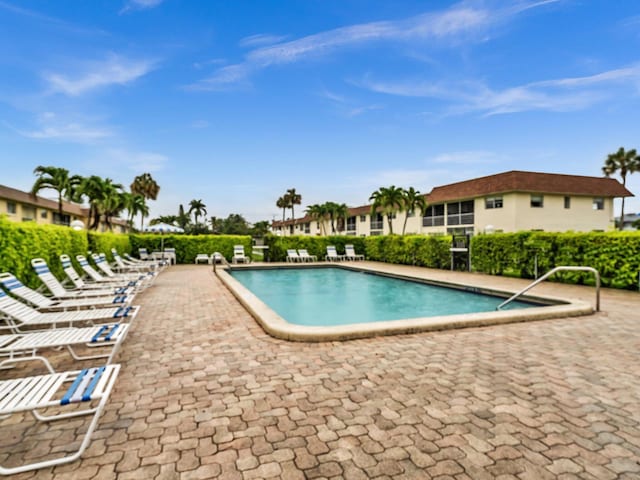 9855 Sandalfoot Blvd Unit 320, Boca Raton, FL 33428 - community pool featuring a patio area