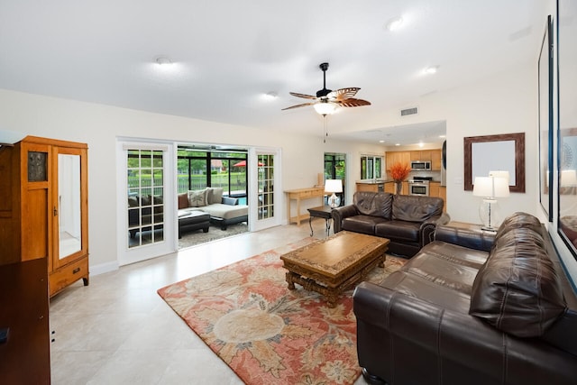 2413 NW 26th St, Boca Raton, FL 33431 - living room featuring a ceiling fan, light tile patterned floors, and baseboards