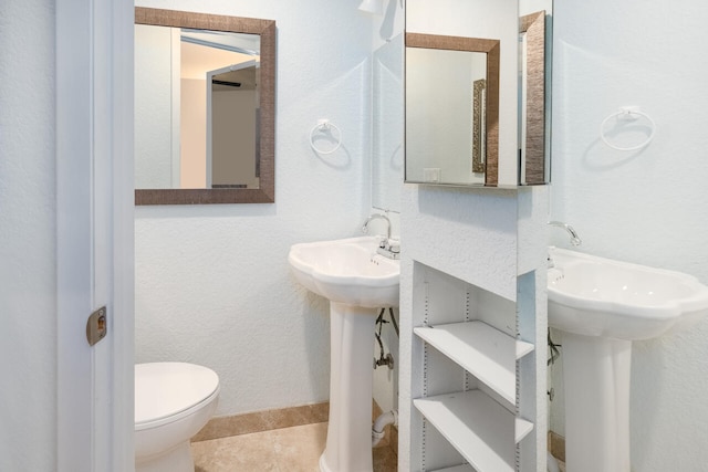 2413 NW 26th St, Boca Raton, FL 33431 - half bathroom featuring toilet, a sink, and tile patterned flooring