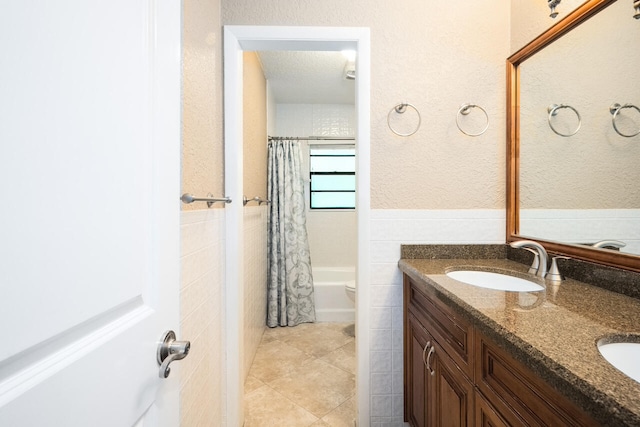 2413 NW 26th St, Boca Raton, FL 33431 - bathroom featuring double vanity, shower / bath combo, and tile patterned floors