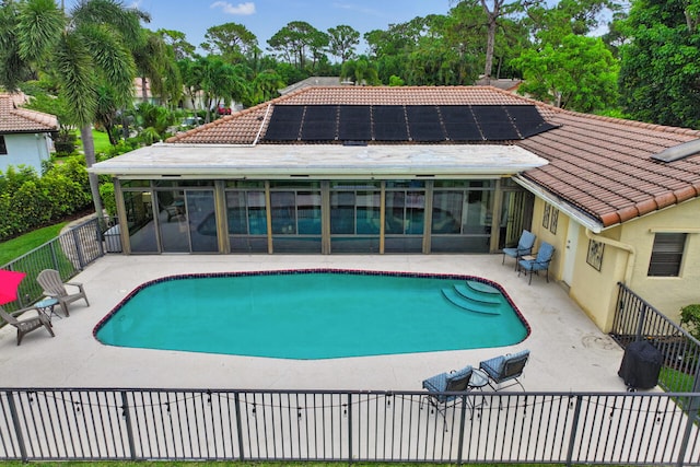 2413 NW 26th St, Boca Raton, FL 33431 - view of pool with a sunroom and a patio