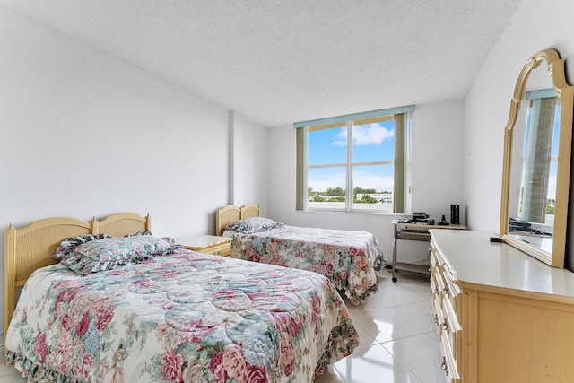 1009 N Ocean Blvd Unit 511, Pompano Beach, FL 33062 - bedroom featuring light tile patterned floors and a textured ceiling