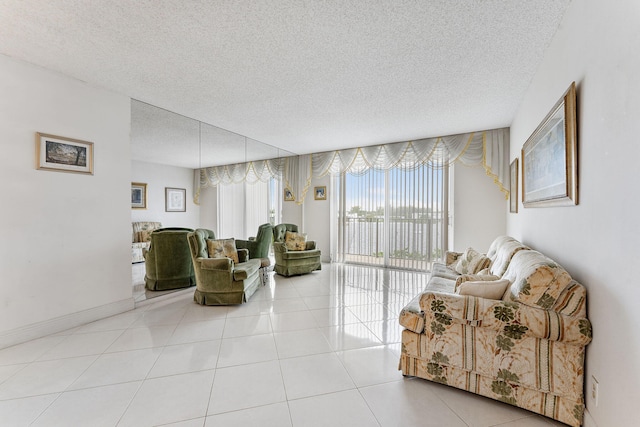 1009 N Ocean Blvd Unit 511, Pompano Beach, FL 33062 - tiled living room with a textured ceiling and baseboards