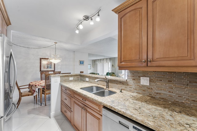 1009 N Ocean Blvd Unit 511, Pompano Beach, FL 33062 - kitchen with a sink, stainless steel appliances, light tile patterned floors, light stone counters, and decorative backsplash