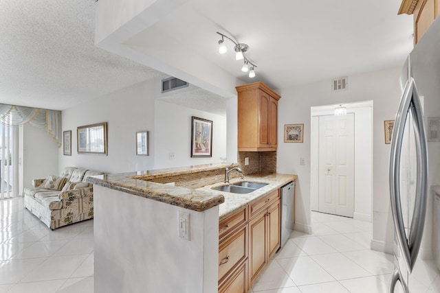 1009 N Ocean Blvd Unit 511, Pompano Beach, FL 33062 - kitchen featuring a sink, appliances with stainless steel finishes, light tile patterned floors, and backsplash