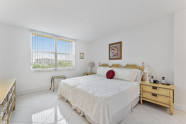 1009 N Ocean Blvd Unit 511, Pompano Beach, FL 33062 - bedroom featuring light tile patterned floors and baseboards