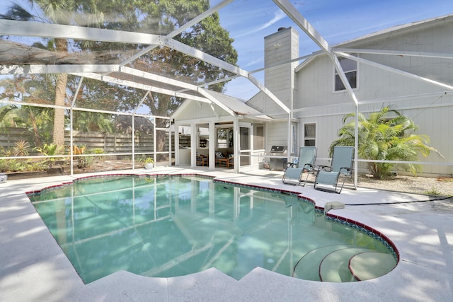2633 SE Export Ave, Port Saint Lucie, FL 34952 - view of pool featuring a patio area and glass enclosure